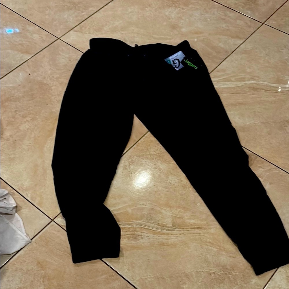 Blue women’s joggers elastic waist is marked extra large,